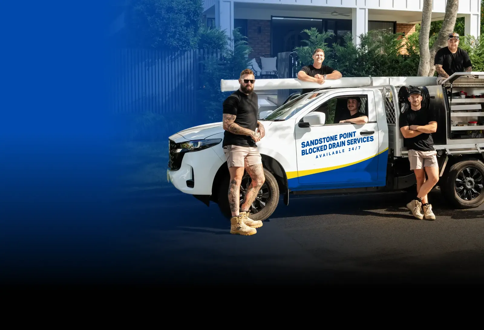 Sandstone Point Blocked Drain Services team with the ute